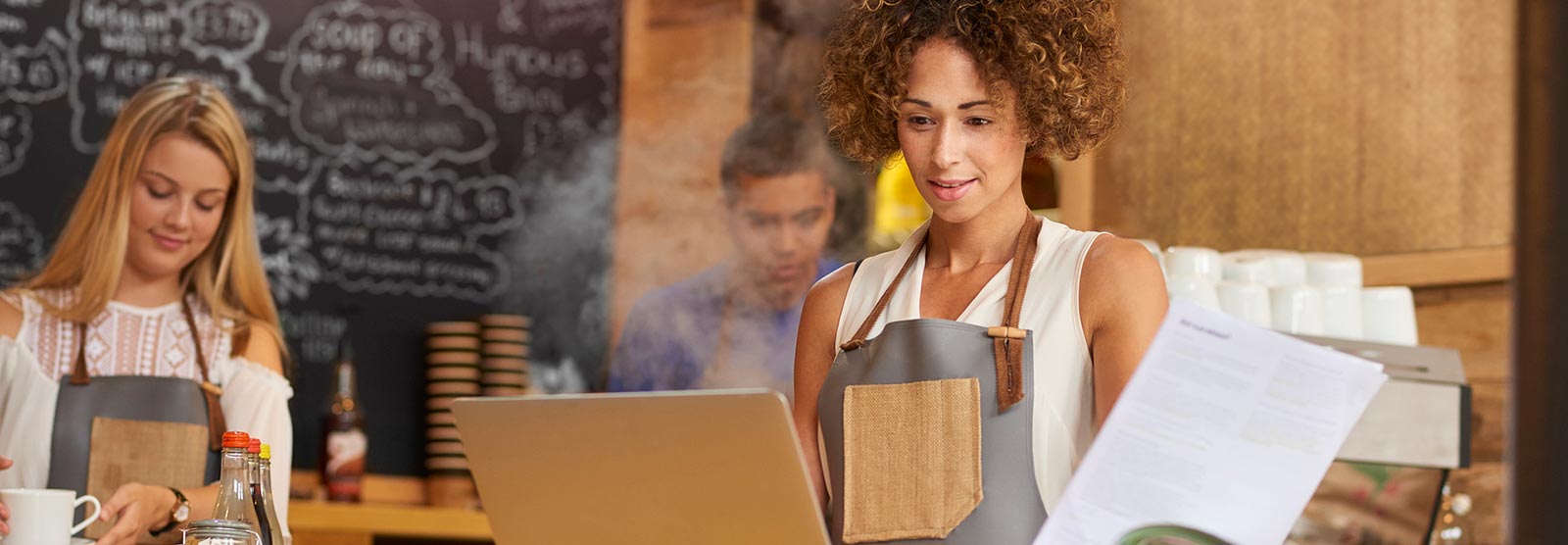 Business owner on laptop computer looking at finances